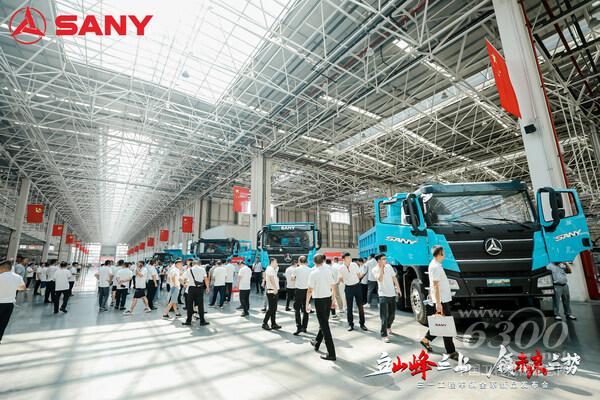 Clients check out the new energy vehicles newly launched by SANY in its industrial park in Changsha.